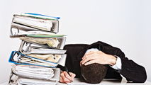 Person being stressed by paper work