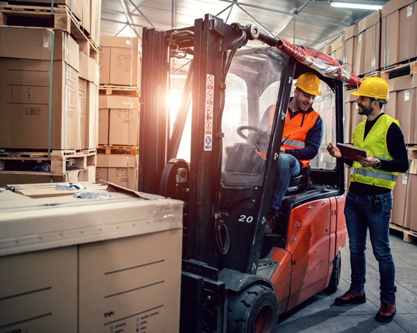 forklift driver and supervisor discussing training