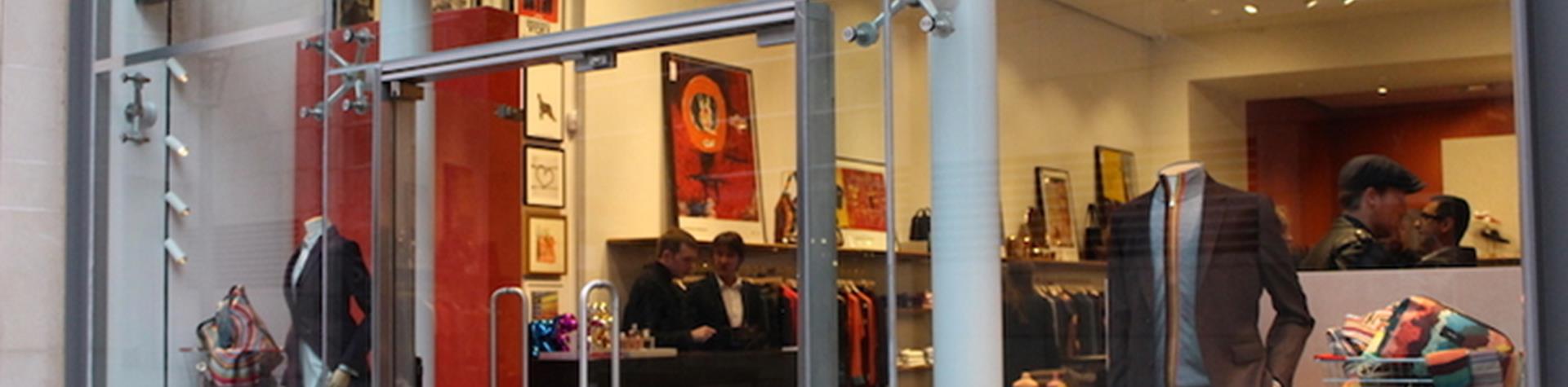 Paul Smith storefront, mannequins wear the latest business attire line